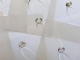 several different types of rings on display in a display case