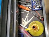 a drawer full of tools and tools in a garage