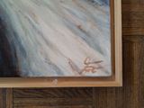 a painting on the wall of a room with wood paneling