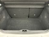 a trunk of a car that is empty with the door open