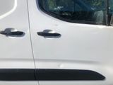 a white van that has two black handles on it
