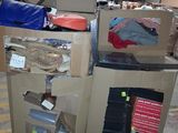 a carton full of boxes and other items in a warehouse