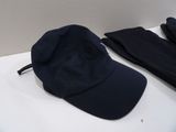 a black hat and a pair of black pants on a table