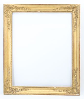 an antique gold frame with a white background