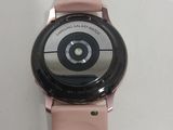a close up of a smart watch on a white surface