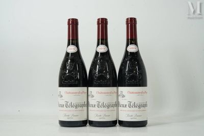three bottles of wine sitting on top of a white table