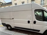 a white van that is parked on the side of the street