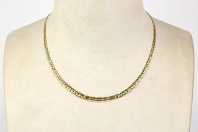 a close up of a mannequin torso with a necklace on it