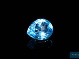 a blue diamond on a black background