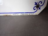 a close up of a blue and white plate on a table