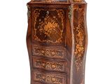 an image of a small wooden cabinet with drawers