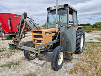 a tractor that is parked in the dirt