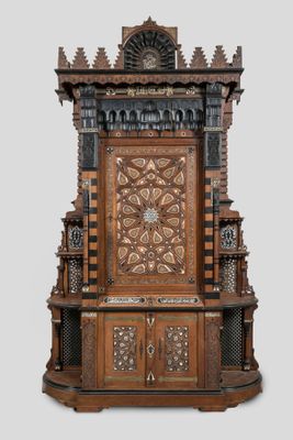 a wooden throne with a clock on top of it