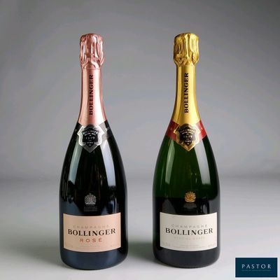 two bottles of champagne sitting next to each other on a table