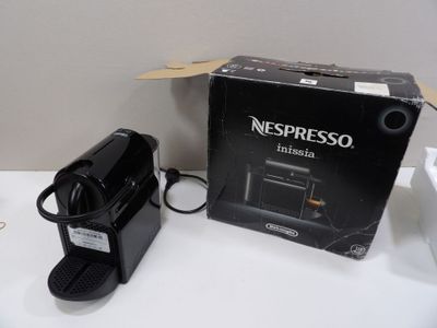 a box of nespresso coffee machines sitting on a table