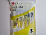 a bag of toothbrushes sitting on a table