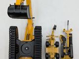 a yellow and black construction vehicle and a yellow and black bulldozer