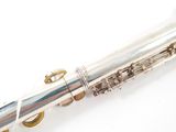 a flute that is sitting on a white surface