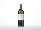 a bottle of wine that is sitting on a table