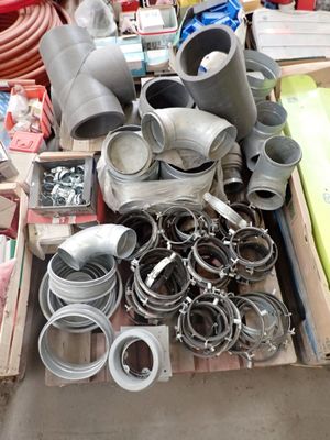 many different types of pipes and fittings in a box