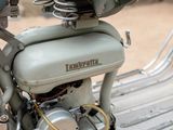 a close up of a motorcycle that is parked on the street