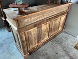 a wooden bar with a bowl on top of it