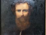 painting of a man with a beard and blue eyes in a gold frame
