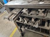 a metal workbench with a lot of tools on it