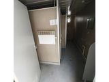 an image of a hallway in a building with a heater on the wall
