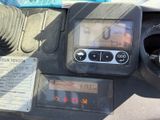 a close up of a car dashboard with a clock on it