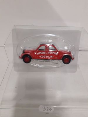 a small red car in a clear box