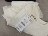 a white t - shirt and a black t - shirt next to each other