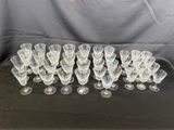 a bunch of wine glasses sitting on top of a table