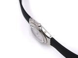 a close up of a wrist watch on a white surface