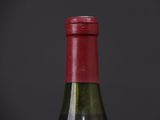 close up of a bottle of wine on a black background