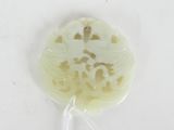 a picture of a piece of white jade with a dragon on it