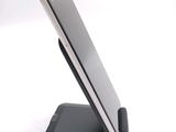 a cell phone that is on a stand on a table