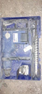a blue tool box with tools in it on the floor