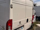 a white van that is parked in a lot