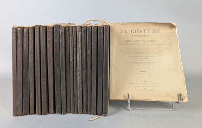 an old book sitting on top of a table next to a stack of books