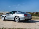 a silver sports car parked on the side of the road