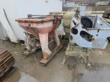 two machines that are next to each other in the yard