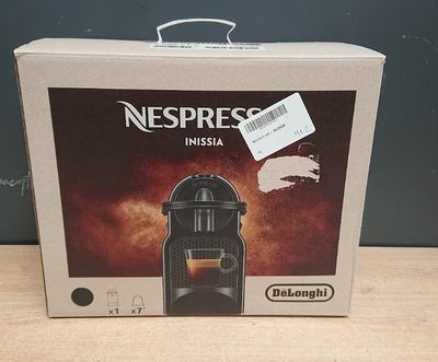 emballage d'une machine à expresso Nespresso posée sur une table