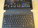 two laptops sitting on a table with a price tag on them