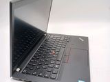 a laptop with a black keyboard sitting on a white surface