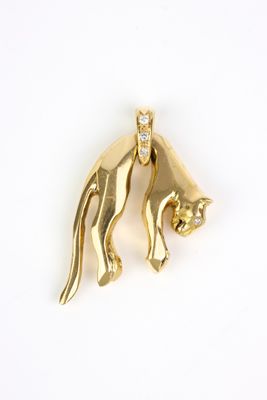 two gold cat charms with diamonds on a white background