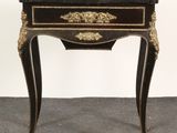 an image of a small table with a drawer on it