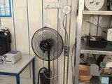 an image of a room with a fan and a table