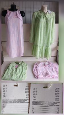 three dresses on display on a shelf in a store