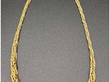 a gold necklace with a chain that has been linked to it